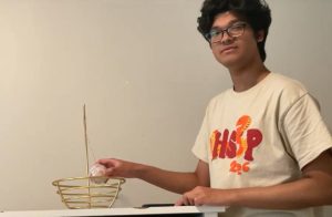 Thumbnail image showing a student and a simple pendulum