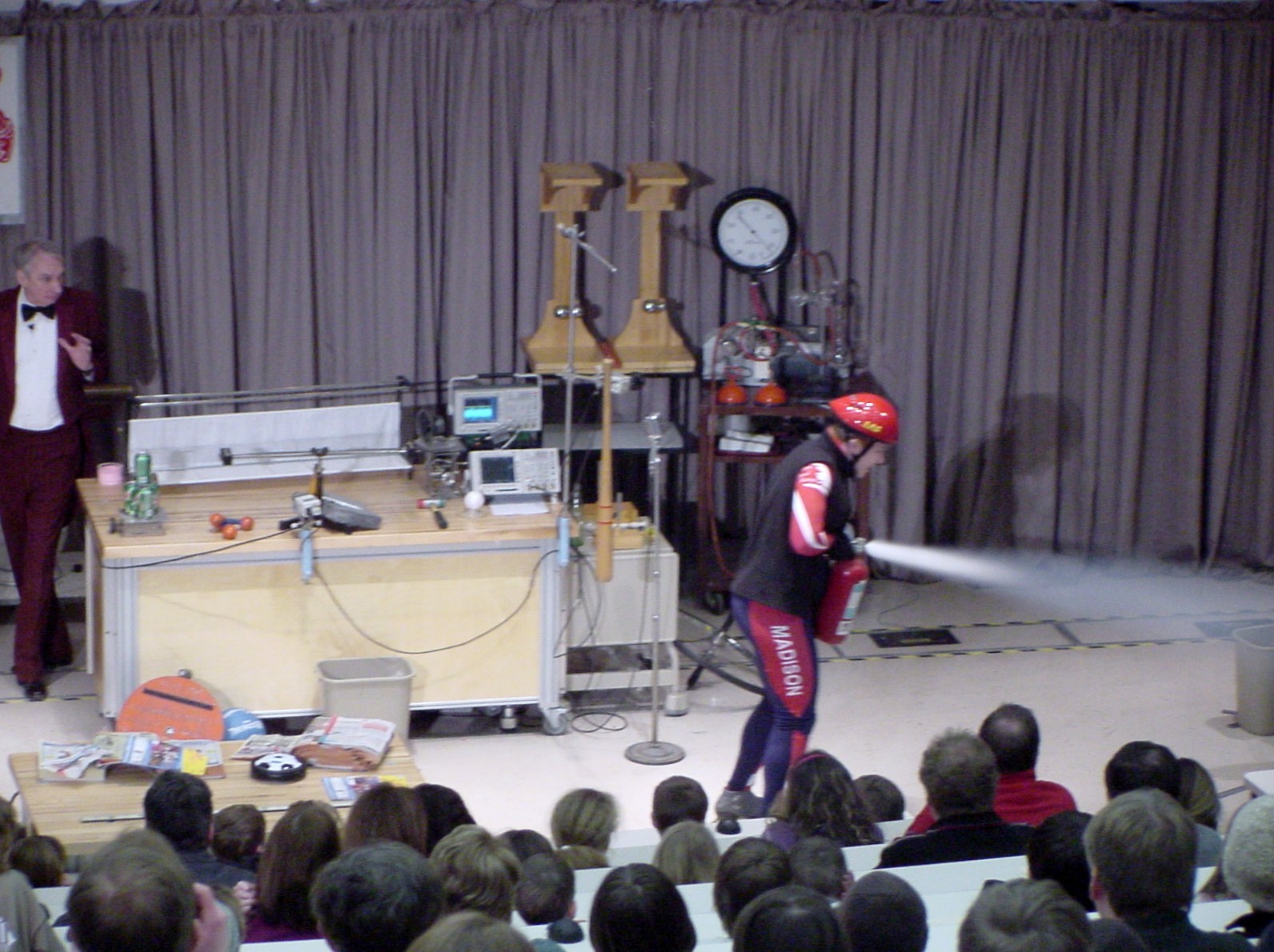 Man on stage doing an experiment