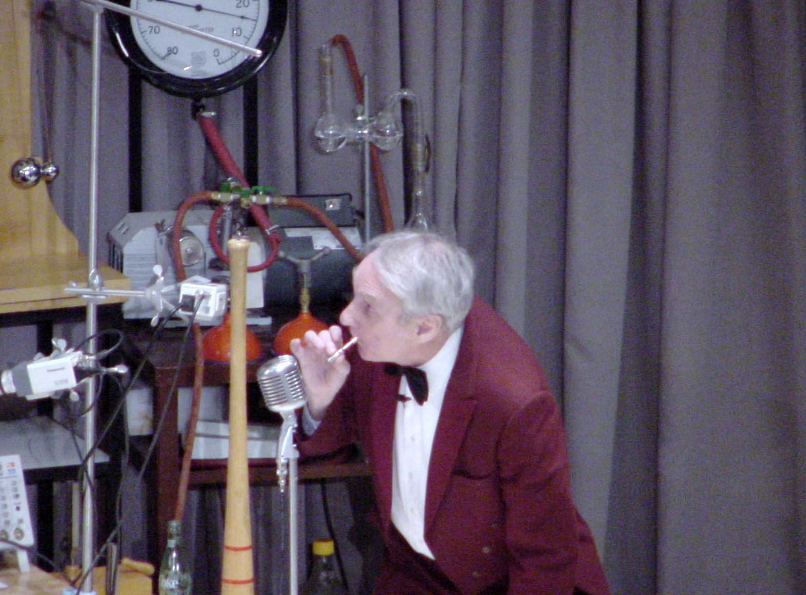 Man on stage doing an experiment