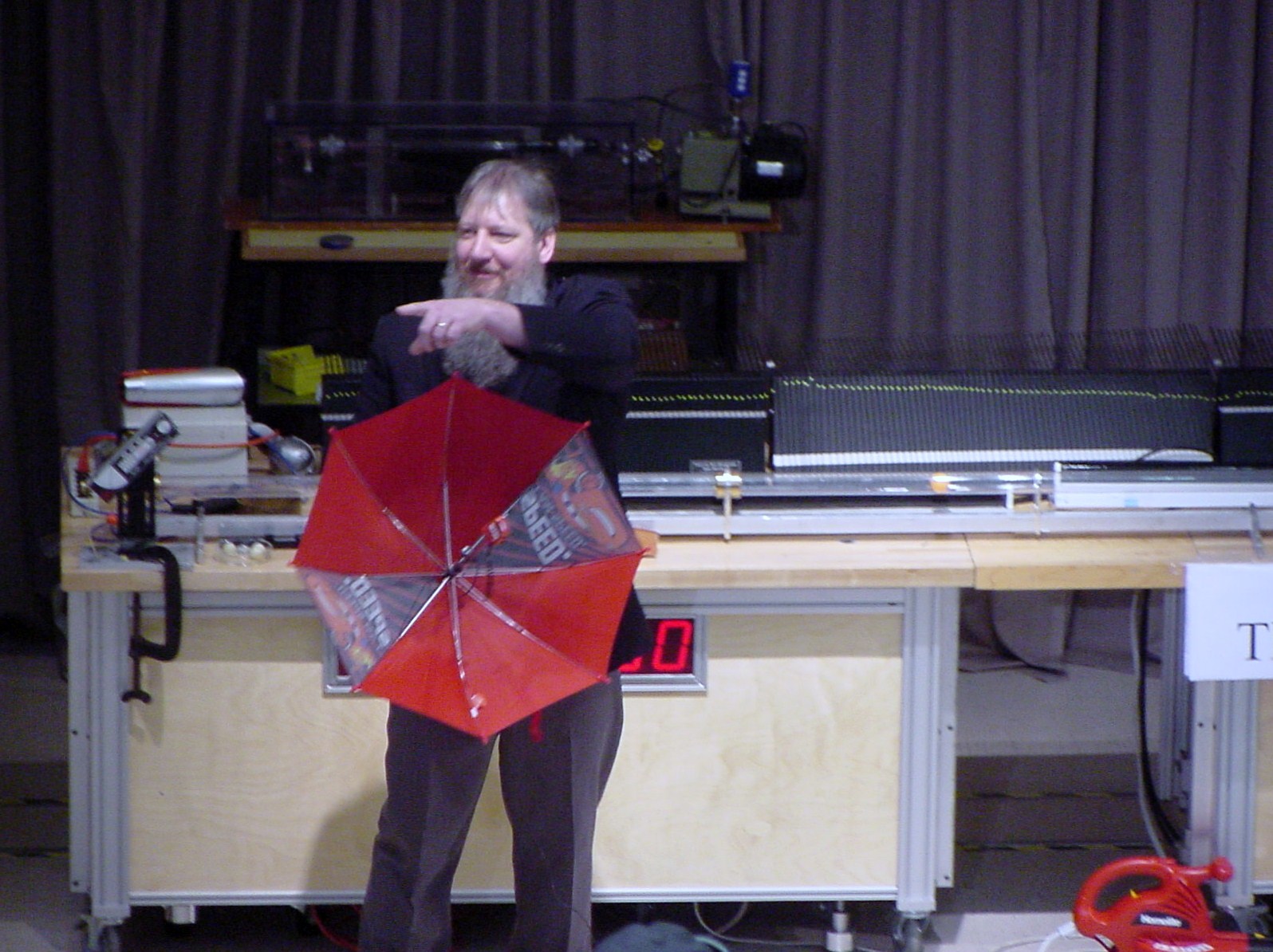 Man on stage doing an experiment