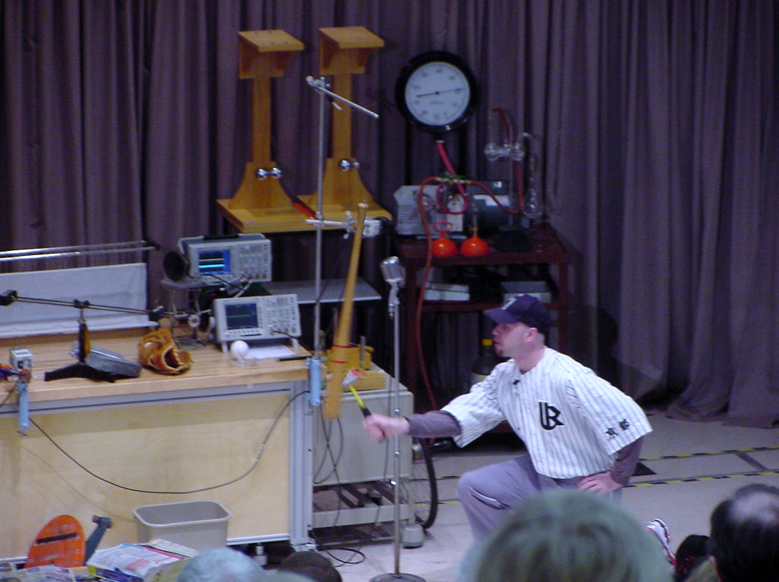 Man on stage doing an experiment