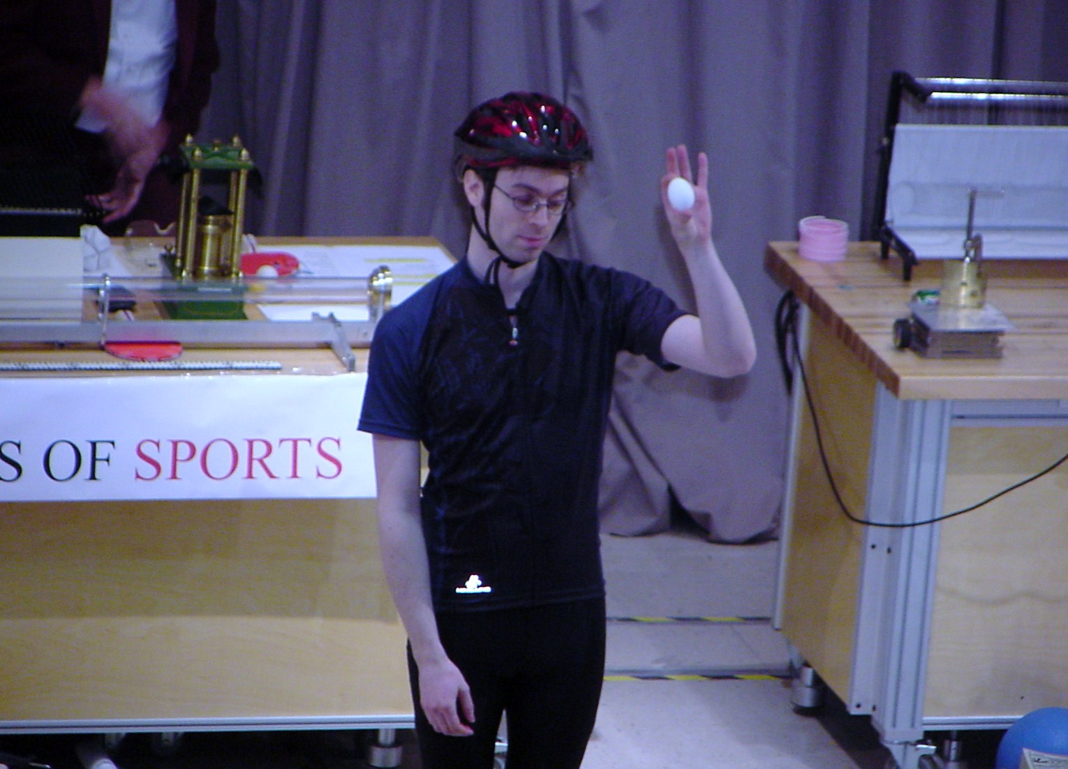 Man on stage doing an experiment