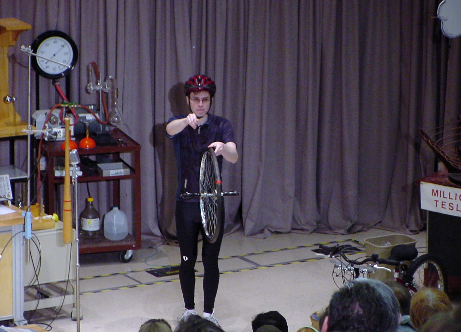 Man on stage doing an experiment