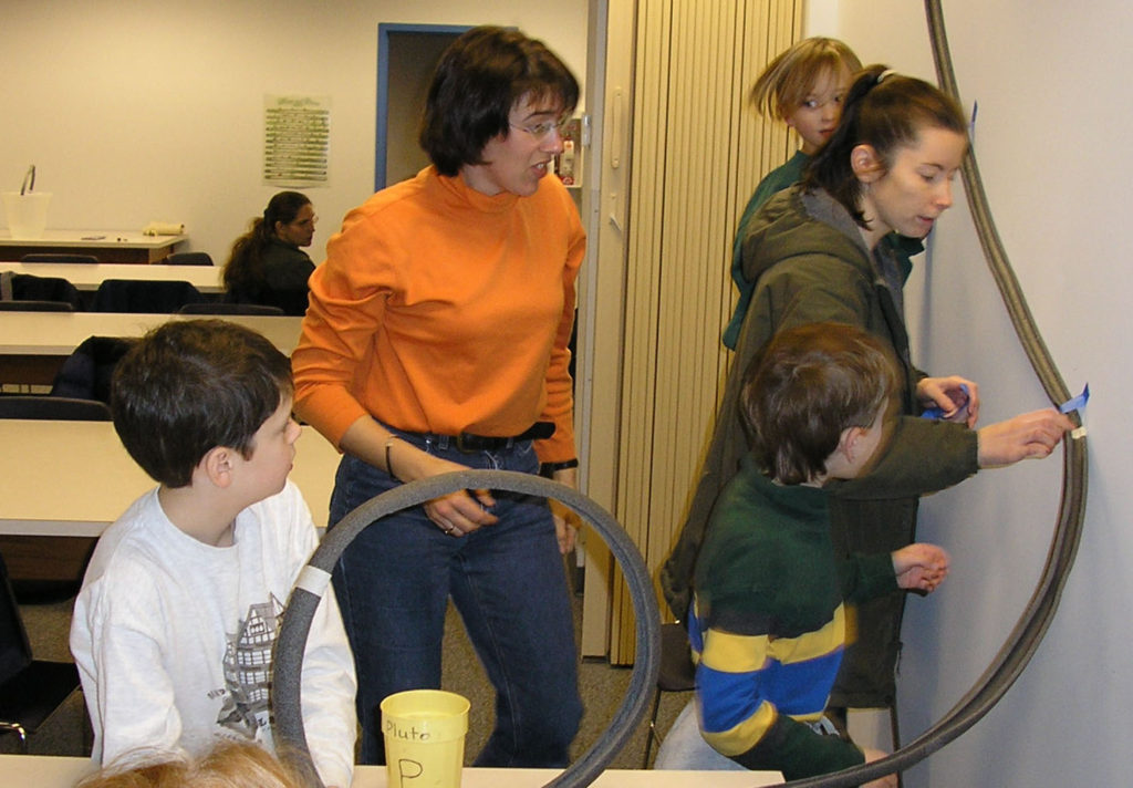 Students building a roller coaster