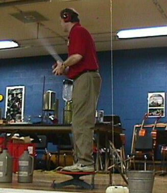 Man showing demonstrating a rocket