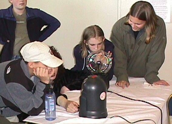 Kids looking at a plasma balll