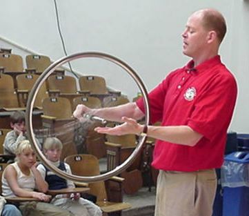 Man spinning a bicycle wheel